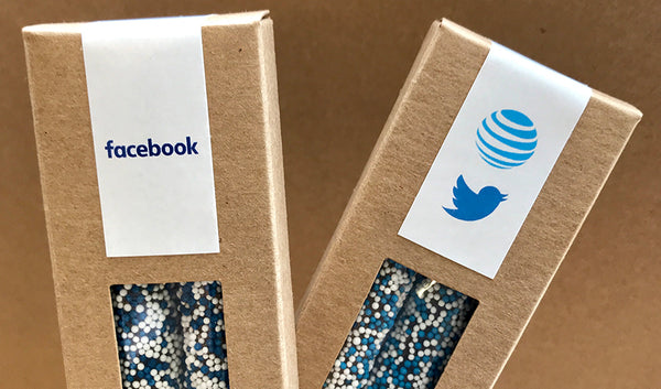 Kraft boxes of two pretzels each with blue and white sprinkles and Facebook, Twitter and AT&T logos