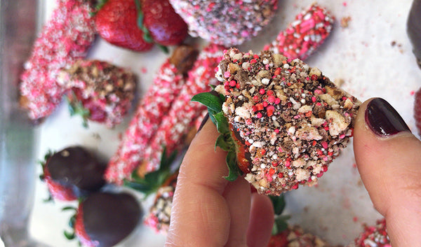 Dark chocolate covered strawberries topped with chopped Valentine's Day Sprinkle pretzels