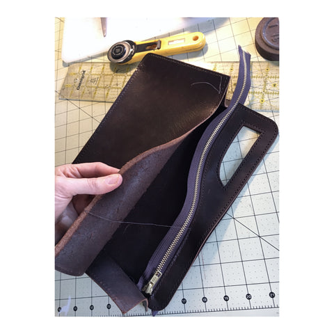Handsewn leather clutch handbag zipper