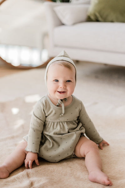 Soft long-sleeve baby dress made with organic cotton from Quincy Mae