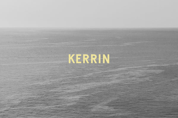 Kerrin logotype in yellow atop black and white seascape