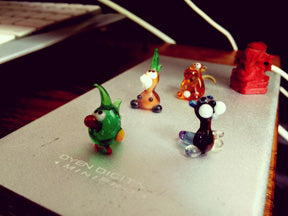Tiny Sculptures on a piece of notebook paper.