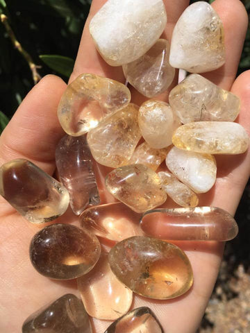 Citrine tumbles: natural on the bottom, heat-treated on the top