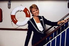 Lauren Tewes as Julie McCoy the social director from the Love Boat