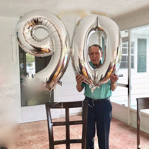 Man celebrating milestone 90th birthday
