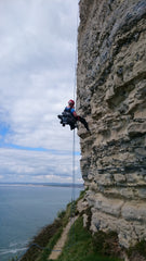 Pongoose abseiling into crag image