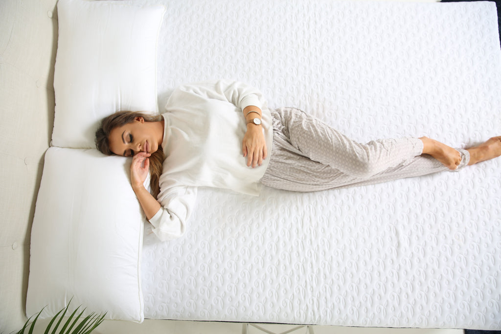 Woman laying on mattress