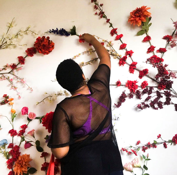 Shanika creating a floral installation