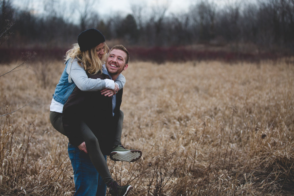 Man giving woman a piggyback