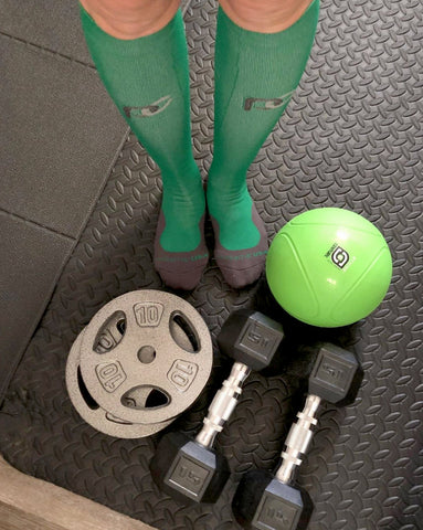 Kelly green compression socks getting us through the dumbell workout today!