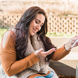 Holding Necklace and reading #ShareYourThree Card