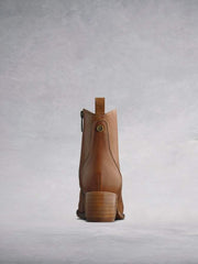 Finished with a stacked Cuban heel and a decorative rear pull-tab.