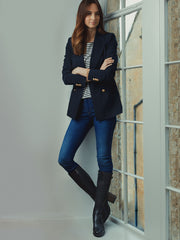 A versatile mid heel tan boot that can be worn comfortably everyday.