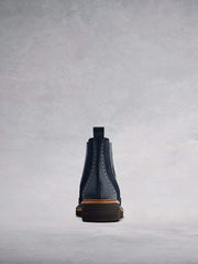 With contrast navy leather broguing and a tan leather trim.