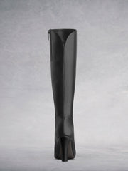 The black leather sweetheart topline complements the curved ankle seam.
