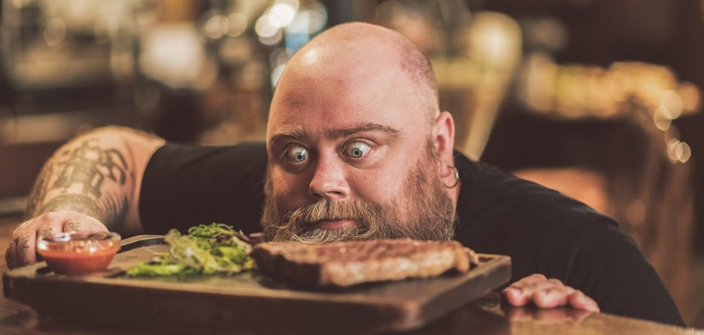 Bearded man with food