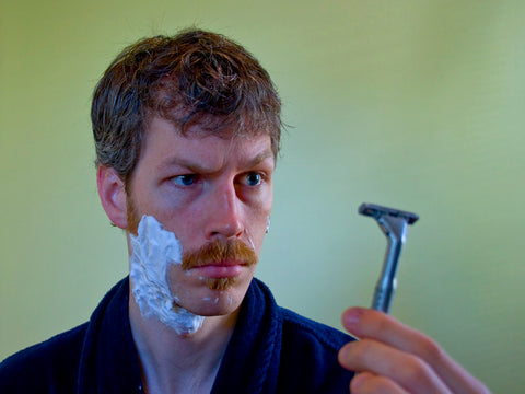 Man shaving beard 