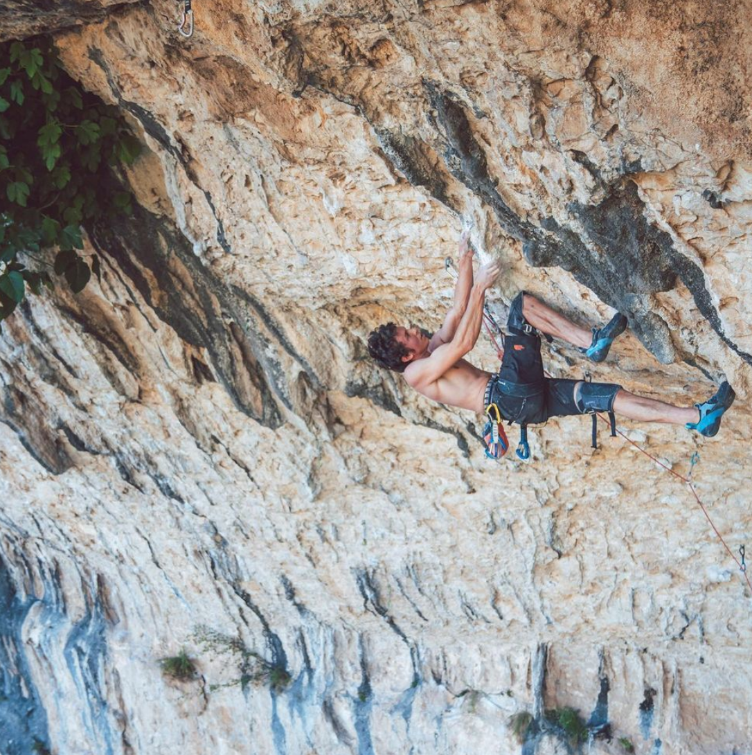 matty climing up a cliff