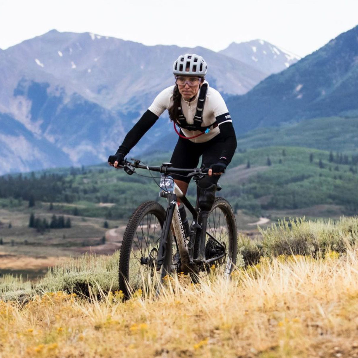 Meg Fisher bikes up a challenging hill on her mountain bike