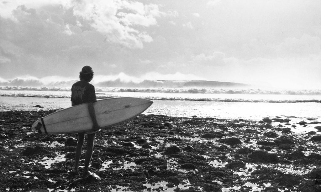 William Finnegan ponders the paddle, Grajagan, Java, 1978