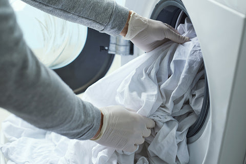 washing-laundry-with-gloves