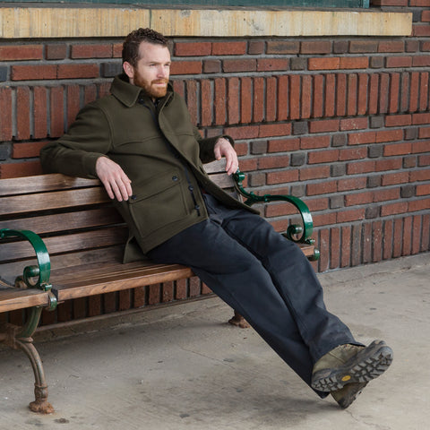 WeatherWool All Around Jac in Solid Drab Color, seated at train station, South Orange, New Jersey