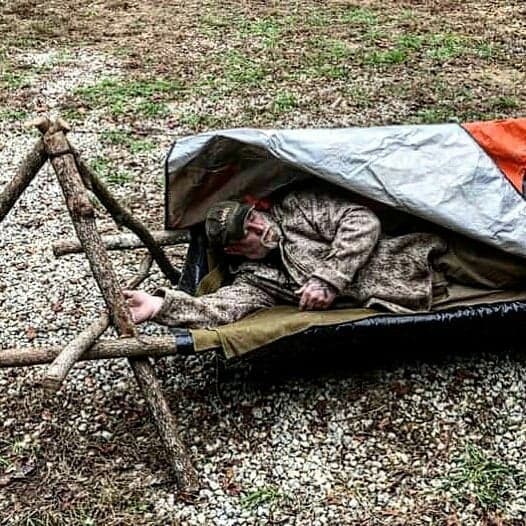 WeatherWool Advisor Dave Canterbury of Pathfinder Survival and Self Reliance Survival Systems, bedding down in his Lynx Pattern WeatherWool Anorak in pure wool FullWeight Merino Jacquard Fabric