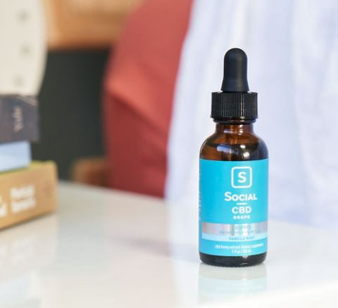 Social CBD Broad Spectrum CBD Drops on table 