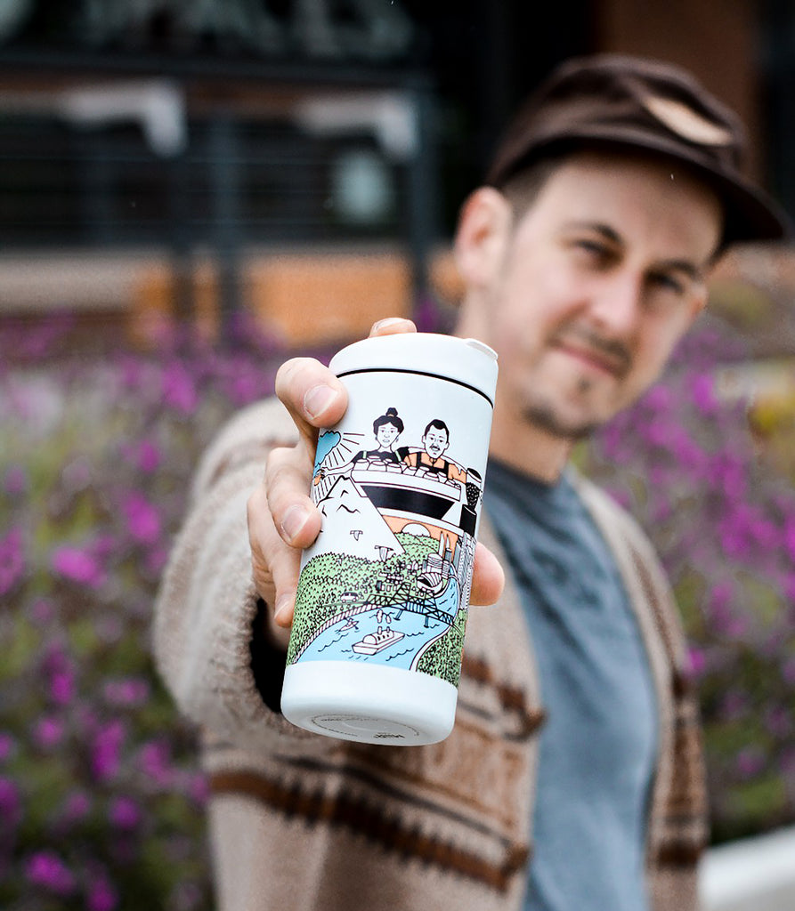 Dan Clinton holding Good Coffee Tumbler