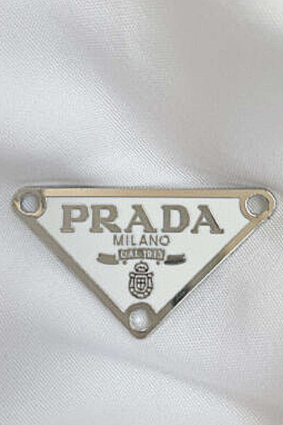 prada emblem replacement