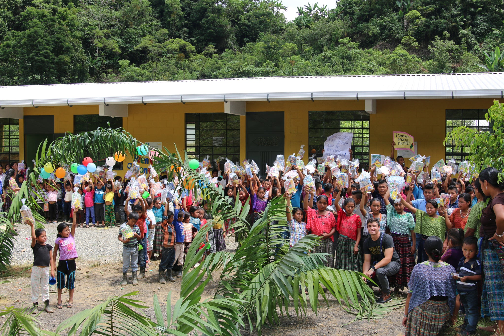 children showing off their school supply bags