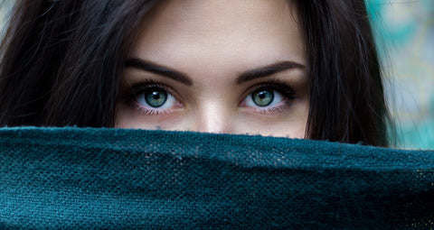 girl with half face covered and beautiful eyes shown