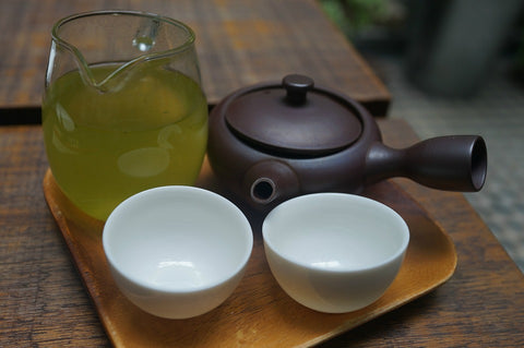 green tea with two bowls and a pot