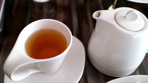 tea pot and tea cup with tea