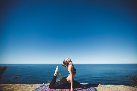 woman exercising at coastal area