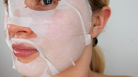 woman wearing facial sheet mask