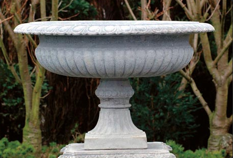 Cast concrete large shallow urn which would look lovely filled with layered greenery.