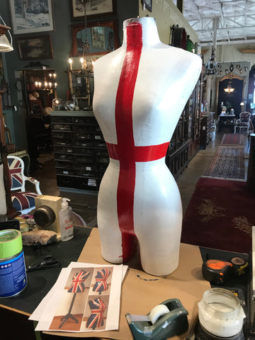 mannequin with red stripe painted in the middle for union jack mannequin