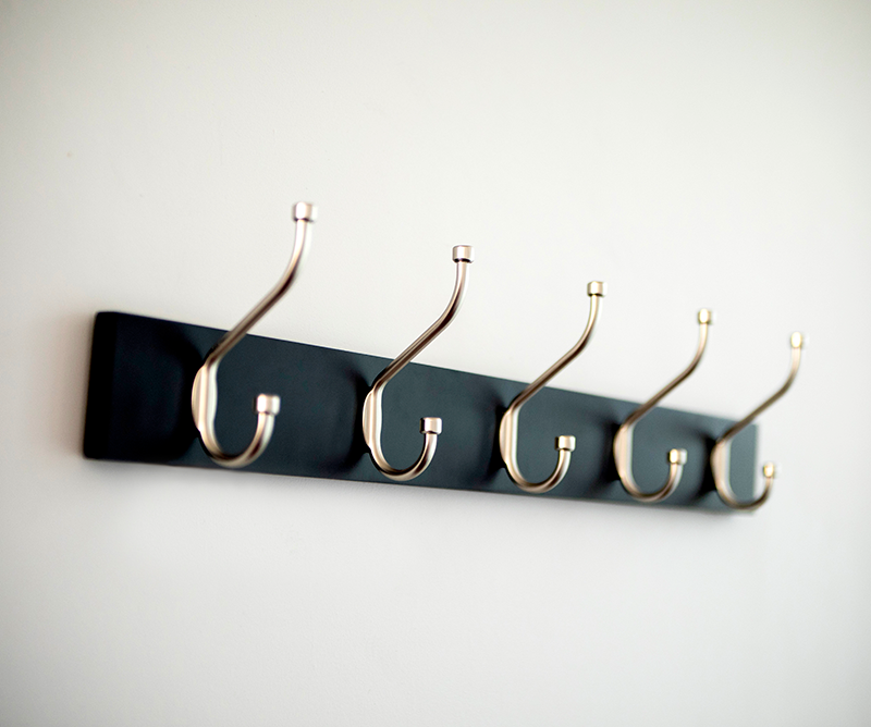 How to Mount a Coat Rack on a Wall Without Drilling