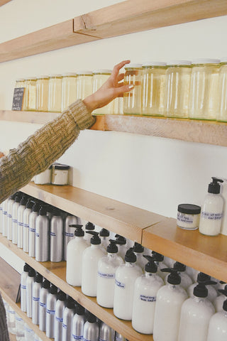 taking liquid soap from shelf