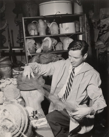 Bill Cunningham is making a hat at his millinery shop in New York in 1956.