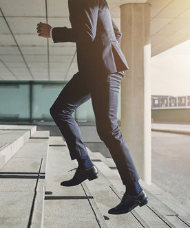 businessman walking up stairs