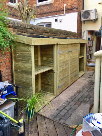 Garden tool storage shed with bin, recycling and log storage. All with living green roof planter to house succulents 