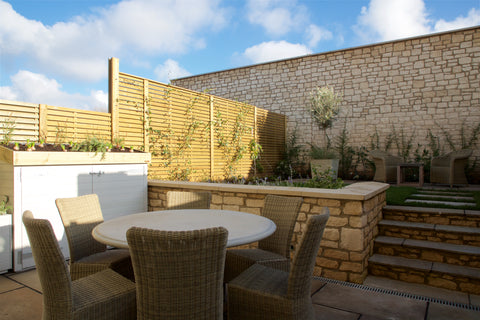 Bespoke bike shed with green roof and matching planter for a new build development's show home