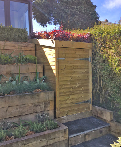 Custom made storage shed in Portishead with living green roof filled with heucheras and grasses