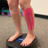 Girl balancing wearing kinesiology tape