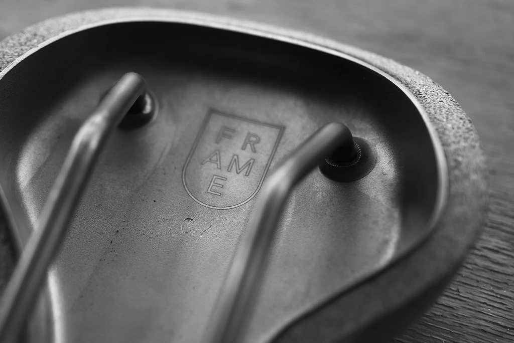 Titanium engraving of cork and titanium bike saddle