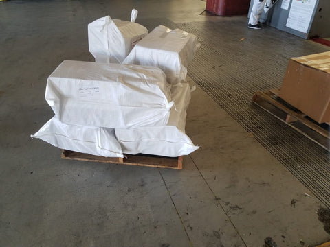 31x45 6-mil contractor bags used to store boxes on a pallet in a warehouse
