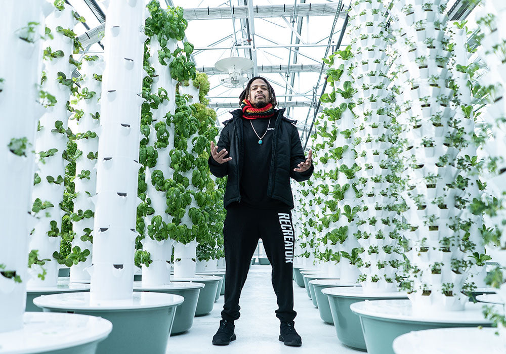 Zion I Baba Zumbi at Altius Greenhouse in Colorado rocking hemp clothing for DJ Cavem's Sprout That Life music video