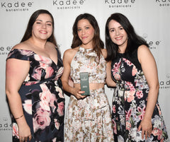 Jackie Tohn from GLOW holding a Kadee Botanicals Body Lotion